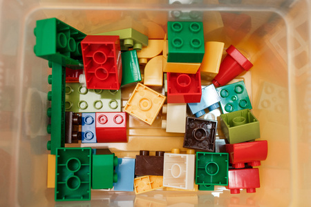 Colorful plastic constructor for children in the box. Top viewの写真素材