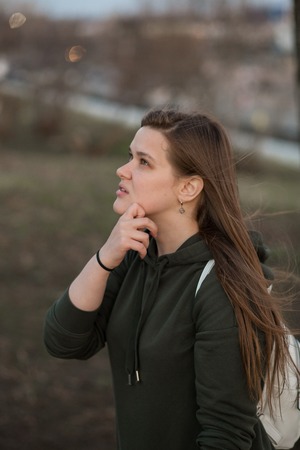 Urban style and fashion concept. Outdoor portrait of beautiful stylish young European female model...