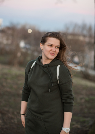 Urban style and fashion concept. Outdoor portrait of beautiful stylish young European female model...