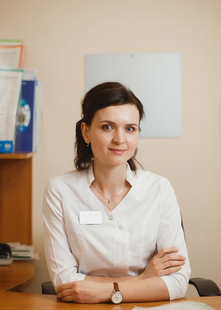 Attractive female doctor ophthalmologist keeping an appointment in ophthalmology clinicの写真素材