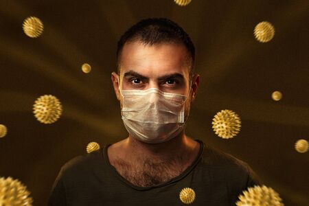 Portrait of caucasian man wearing protective mask against the coronavirus and viral models in the...