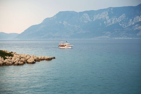 Touristic Yacht of the Aegean Sea with islands, rocks, deep blue water and mountains in the background. Marmaris, Turkey.の写真素材