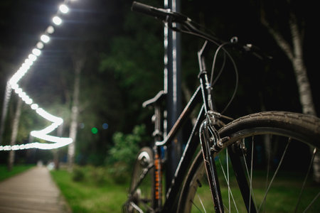 City Parked Bicycle Bike In European City In Night Time.の写真素材