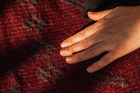 touching handmade carpet by wool