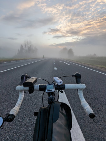 Road bike on the highway before a long-distance race on a foggy morning. High quality photoの写真素材