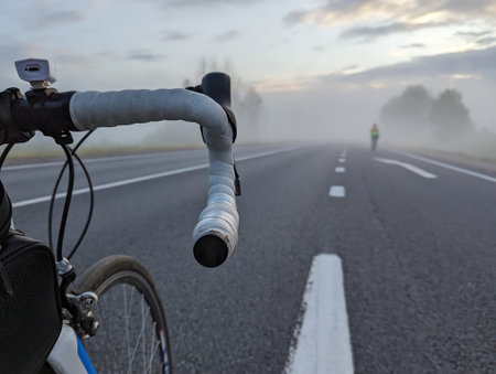 Road bike on the highway before a long-distance race on a foggy morning. High quality photoの写真素材