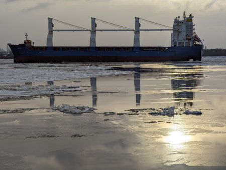 Cargo Ship Pushes a Tug in the Ice. High quality photoの写真素材