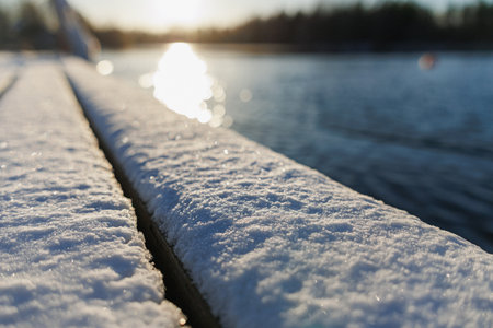 Snow Covered Railing By Lake Sunrise, Closeup Of Frost On Wooden Handrail, Shallow Depth Of Field,...
