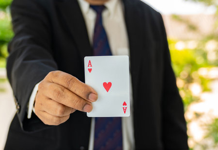 Business man shown a red Ace playing card.の写真素材