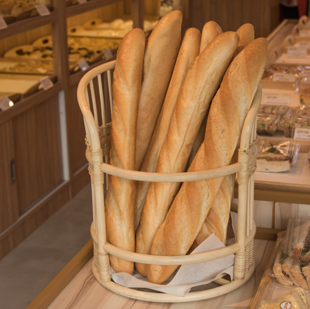 Fresh bake  bread from oven in wood basketの写真素材