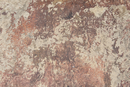 Old stone wall peeling paint backgroundの写真素材