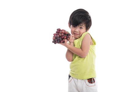 Close up of asian boy smiling on white background isolatedの写真素材
