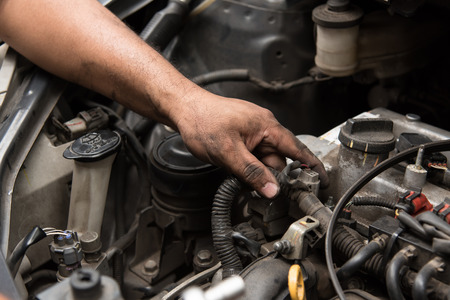 Close up of mechanic hand fix the engine