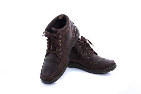 Close up of old vintage leather boot on white background isolatedの写真素材