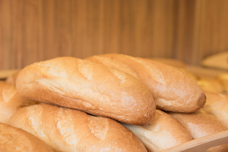 Close up of fresh bake bread on wooden tray in tokyo bakery shop japan.の写真素材