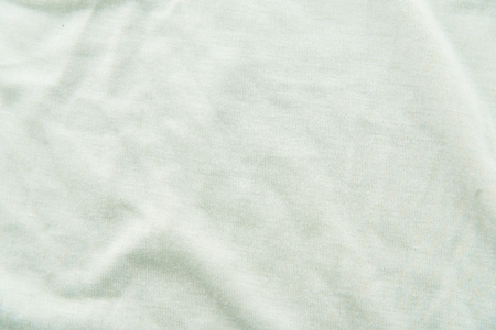Close up of beautiful wrinkle light green fabric texture.の写真素材