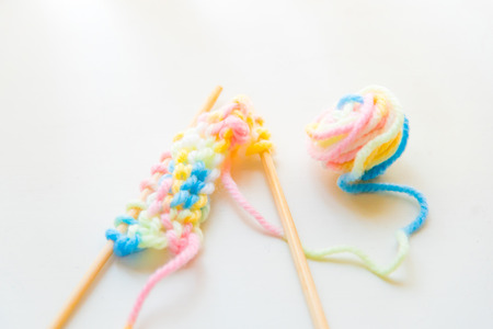 Close up of beautiful color yarn on the wooden table.の写真素材