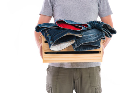 Close up of classic japan denim jean in wooden box on white background isolated.の写真素材
