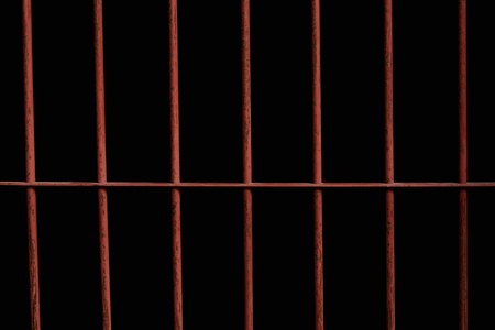 Close up of old rusty iron bar in jail.の写真素材