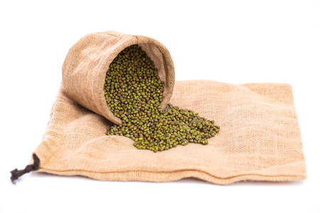 Close up o mung bean in sack bag on white background isolated.の写真素材
