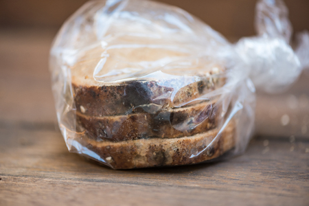 Close up of black fungus on expire organic french bread made from wheat flour raisin and multi grain...