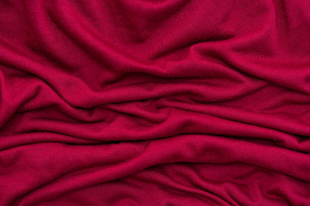 Close of beautiful red wrinkled fabric texture background.の写真素材