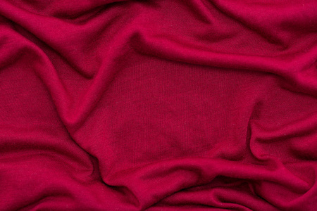 Close of beautiful red wrinkled fabric texture background.の写真素材