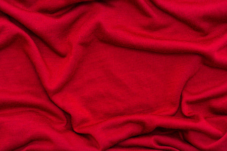 Close of beautiful red wrinkled fabric texture background.の写真素材
