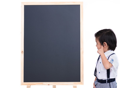 Close up of smart asian boy and wooden blackboard on white background isolated.の写真素材