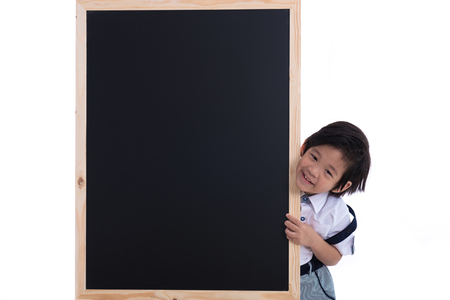 Close up of smart asian boy and wooden blackboard on white background isolated.の写真素材