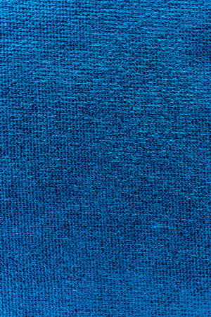 Close up of wrinkled light blue polyester fabric texture background.の写真素材