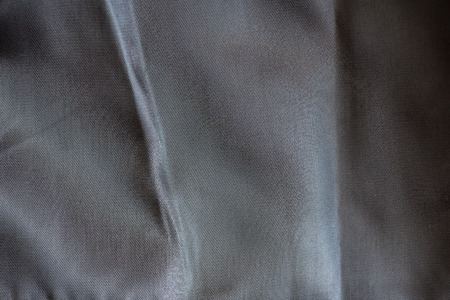 Close up of wrinkle black cotton fabric texture background.の写真素材
