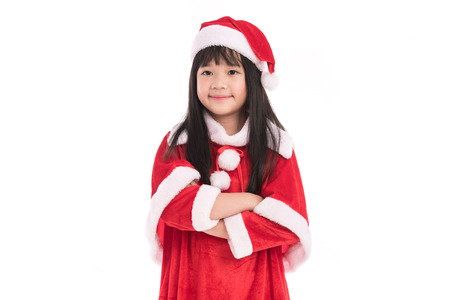 Close up of cute litlle asian girl in santaclaus suit on white background isolated.の写真素材