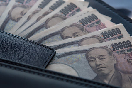Close up of ten thousand yen banknote call ichiman  banknote in japan inside black business leather...