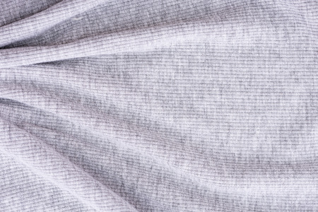 Close up of wrinkled grey cotton fabric texture background.