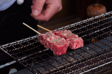 Close up of japan A5 beef called  Hida wagyu grilled on the oven in takayama Gifu Japan.の写真素材
