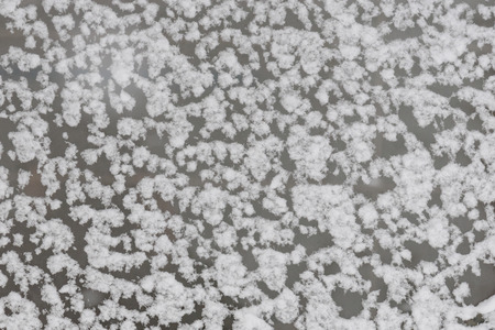 Beautiful ice texture on the mirror background.