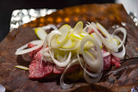 Close up of traditional japanese food called Oba miso beef made from hida wagyu beef and miso grilled on magnolia leaf Takayama Japan.の写真素材
