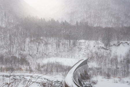 Beautiful stone bridge cover by snowand sunlight  in winter okuhida takayama Japan.の写真素材