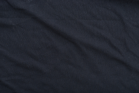 Close up of old dirty wrinkled black bedsheet fabric texture background.の写真素材