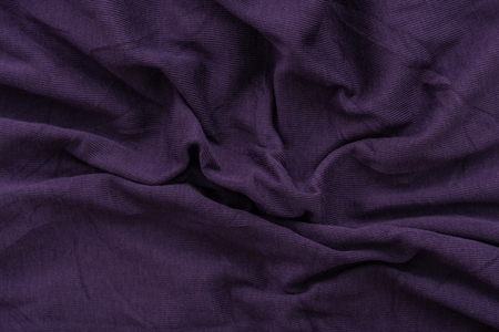 Close up of old dirty wrinkled purple bedsheet fabric texture background.の写真素材