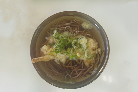 Close up fo japan local food called tempura soba contain with soba soup and deep fried shrimp in japanese restuarant Asamushi Aomori Japan.の写真素材