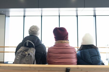 Close up of family waitng at the stationの写真素材