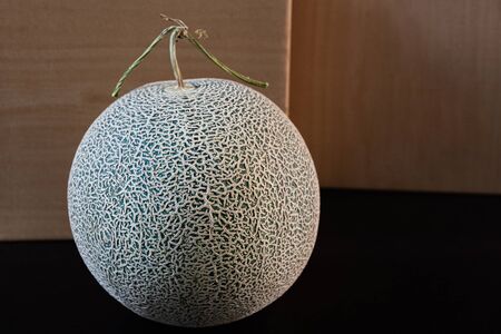 Close up of high quality organic melon growth by Japanese gardener in the glass house use for gift to special person Yubari Japan.の写真素材