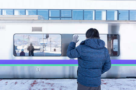Close up of happy asian man waiting for his family at railway station.のeditorial素材