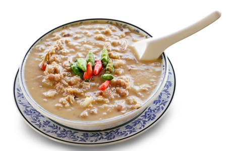 crab stew in the bowl with spoon on isolate white backgroundの写真素材