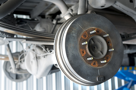 Car Rear drum brake without tire while waiting to get maintenance. selective focused.の写真素材