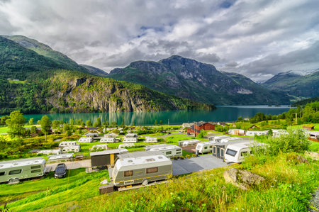 camping with caravans next to a lake in Norwayの写真素材
