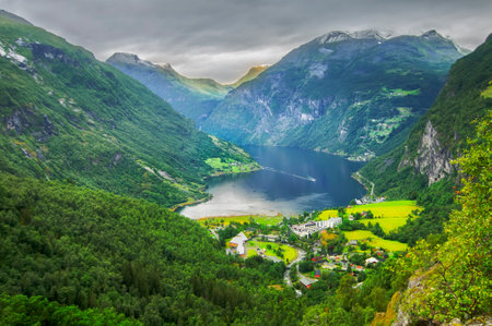 view of the fiord of geiranger from above with the lake and the mountains in norwayの写真素材