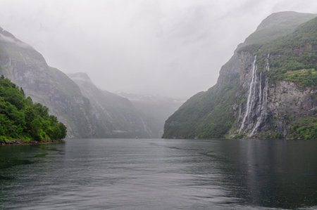 seven sisters waterfall with calm water in the fiord in norwayの写真素材